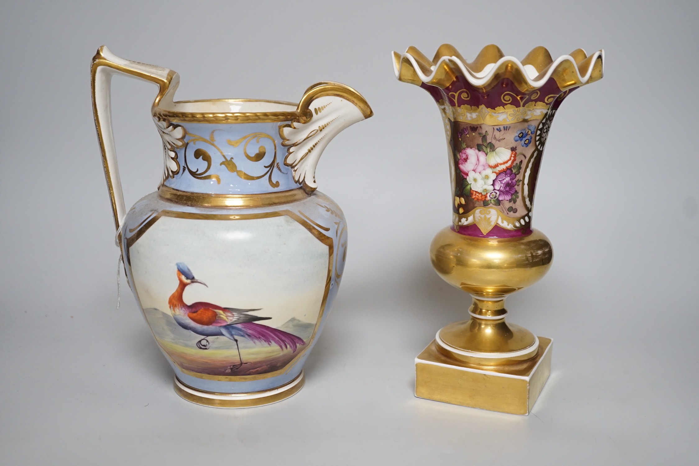 An H & R Daniel jug decorated with exotic birds 22cms high and a floral decorated trumpet vase, pattern no. 1040, 22cm